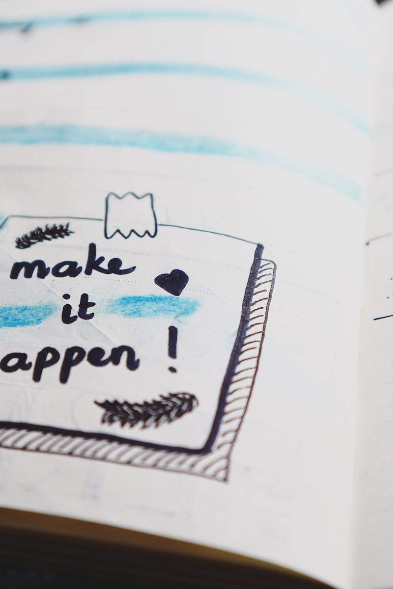 Close-up view of a planner page with motivational text and colorful designs.